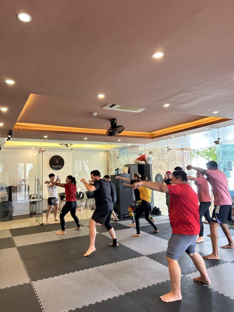 Muay Thai class at RHINO Thai Boxing Gym in Hanoi with travelers
