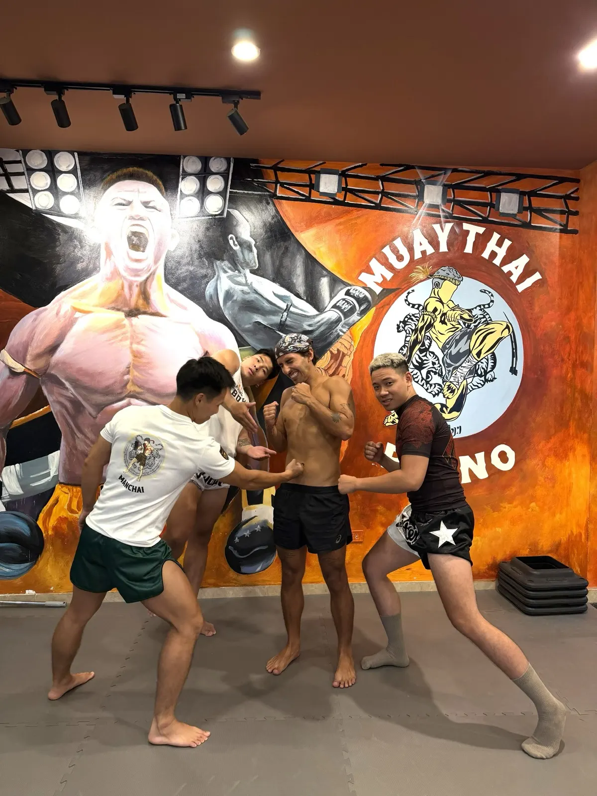 A small group class training on the pads at Rhino Thai Boxing Gym